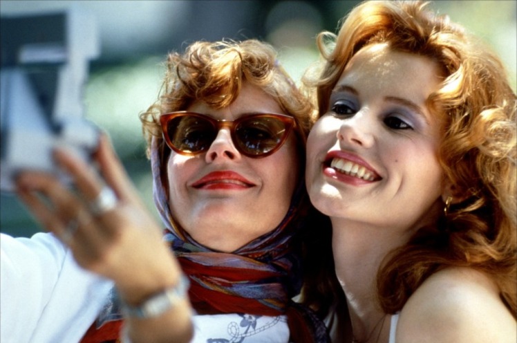 Thelma and Louise (Geena Davis and Susan Sarandon) pose for a selfie.